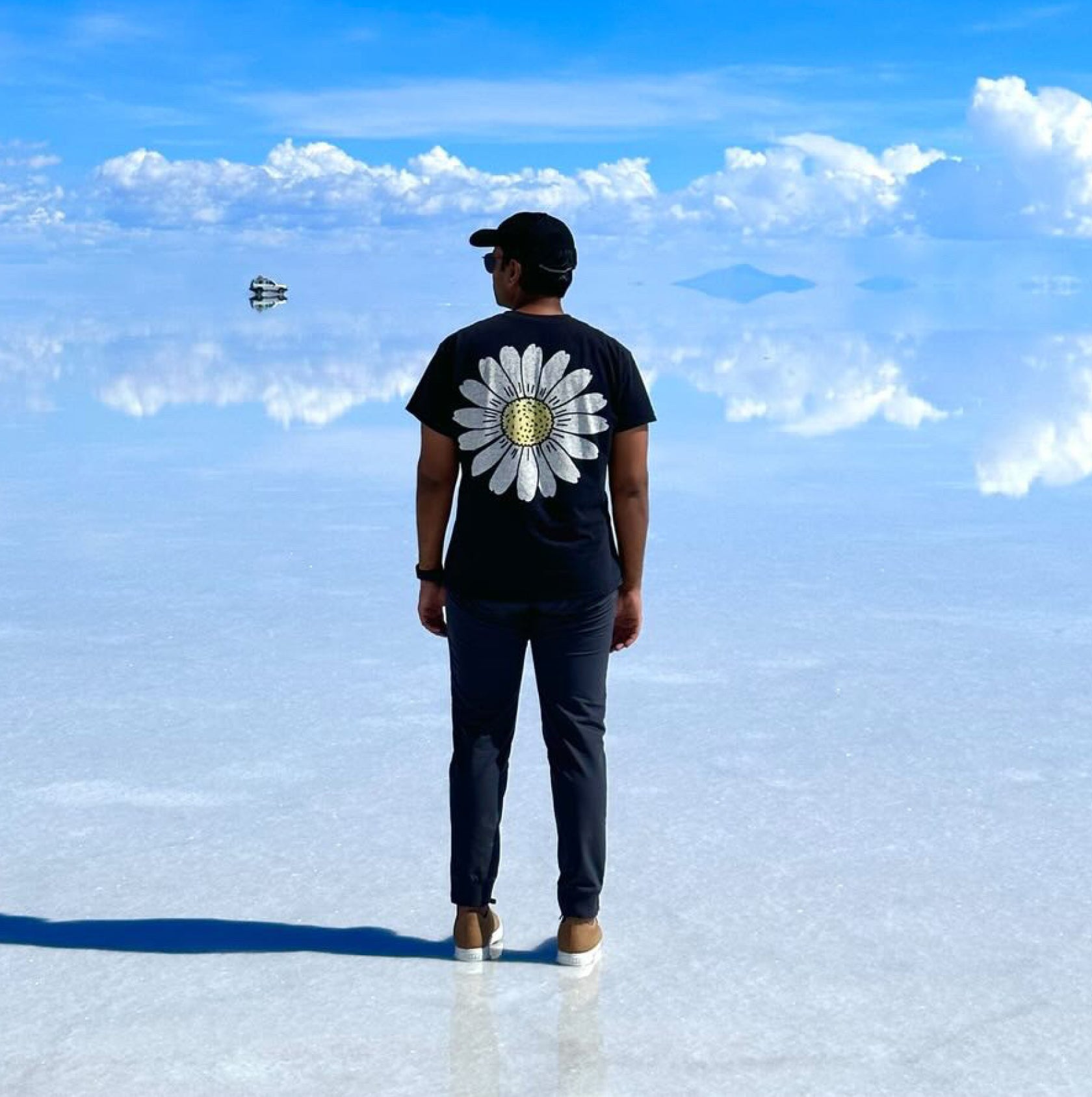 Man standing on the salt lake wearing Mack Weldon pants