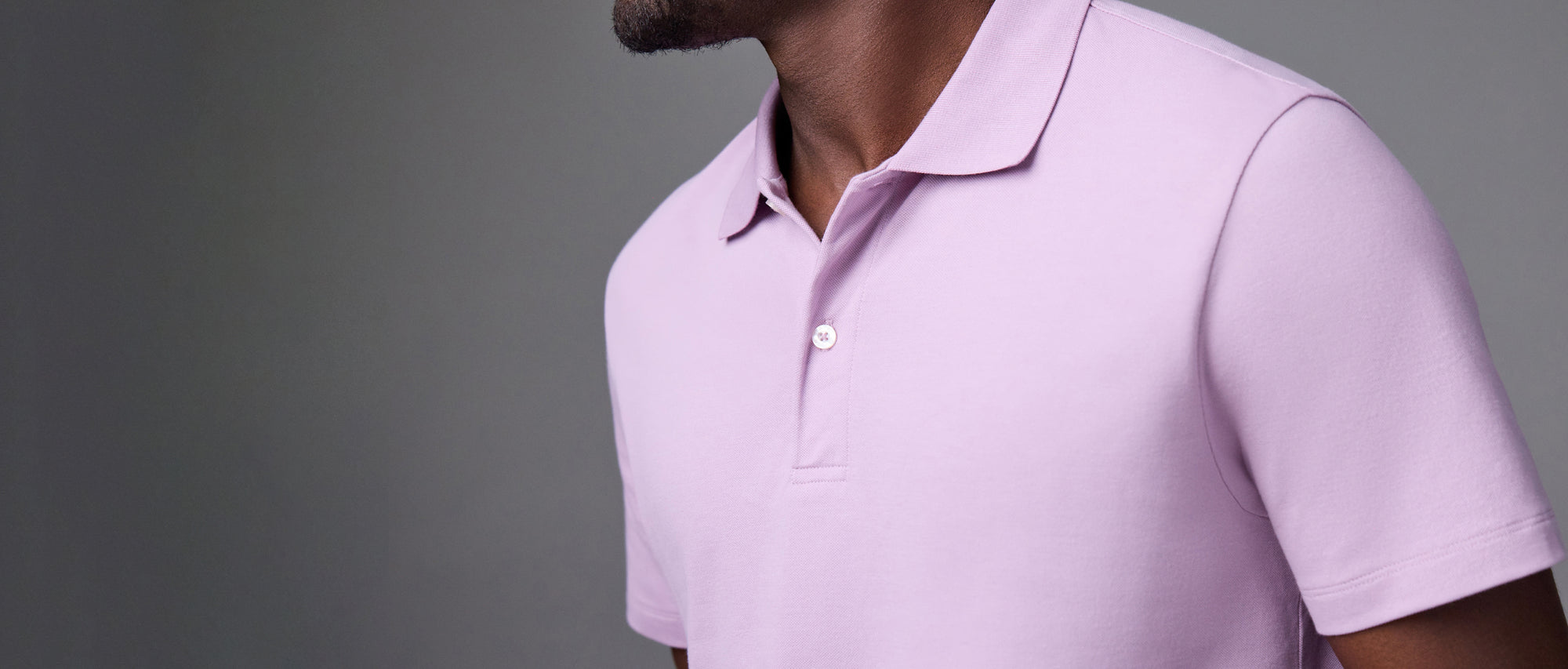 man wearing pink polo