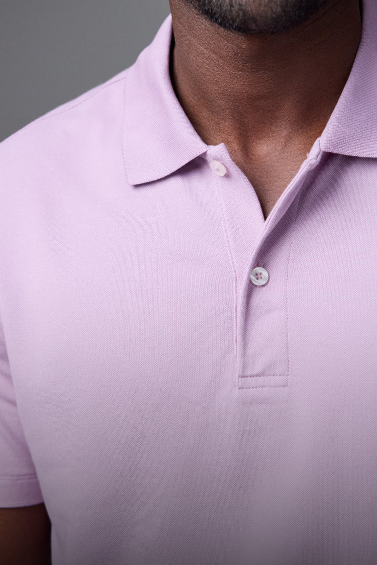 man wearing pink polo