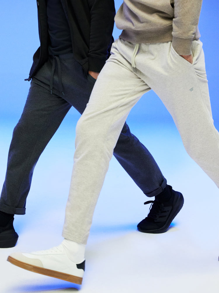 waist down image of two mean walking wearing ACE sweatpants