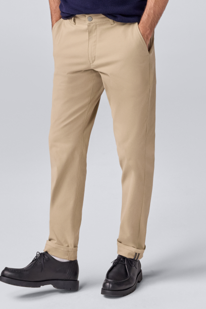 Man wearing Maverick Tech Chino Pants in Sandstorm