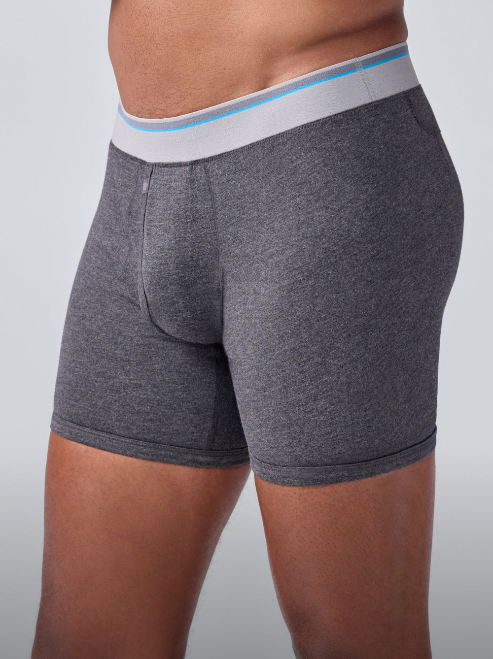 Side view of a man wearing 18 Hour Jersey Boxer Brief in Charcoal Heather