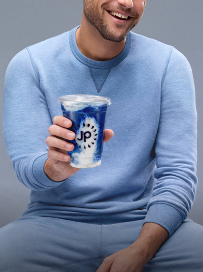 Model n ACE Sweat Suit holding new Mack Weldon x Juice Press Collab smoothie