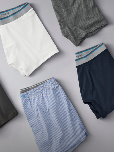 Four pairs of underwear in different colors on a light gray background