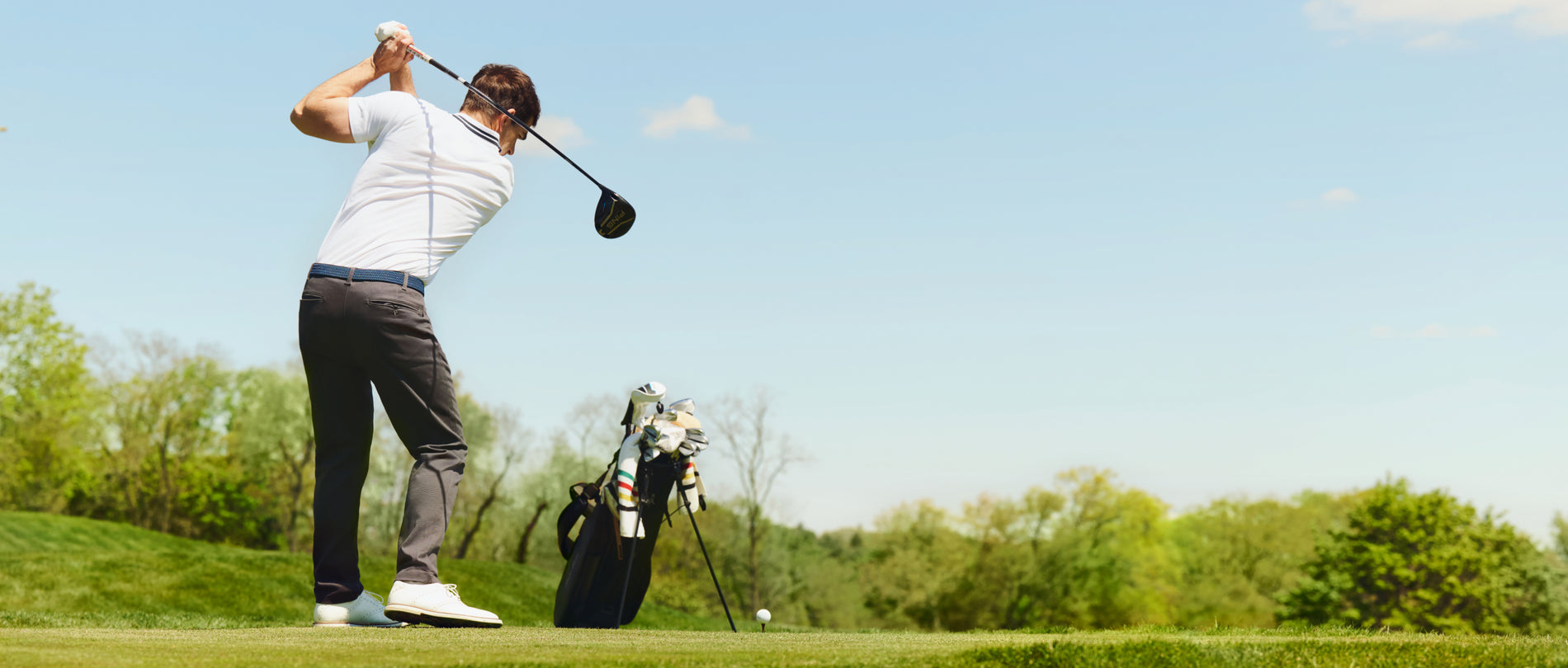 Shane Bacon playing golf wearing Silver Pique Polo 
