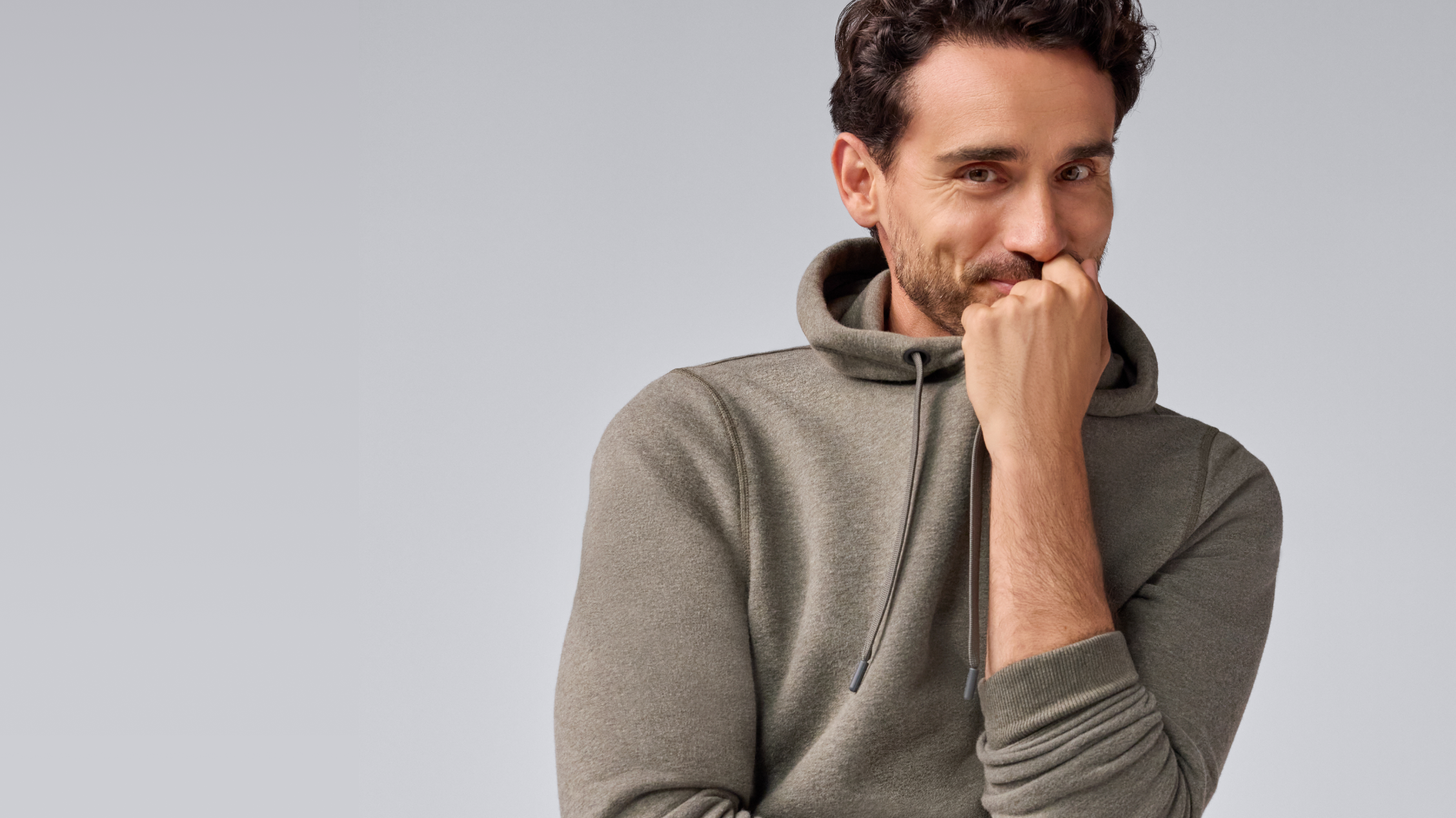 Man wearing Ace Pullout Hoodie Sweatshirt in Sage Heather