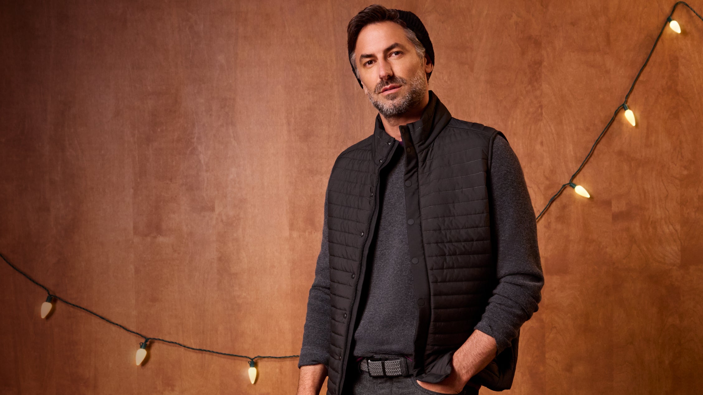 Man wearing WARMKNIT AIR Puffer Vest in True Black color