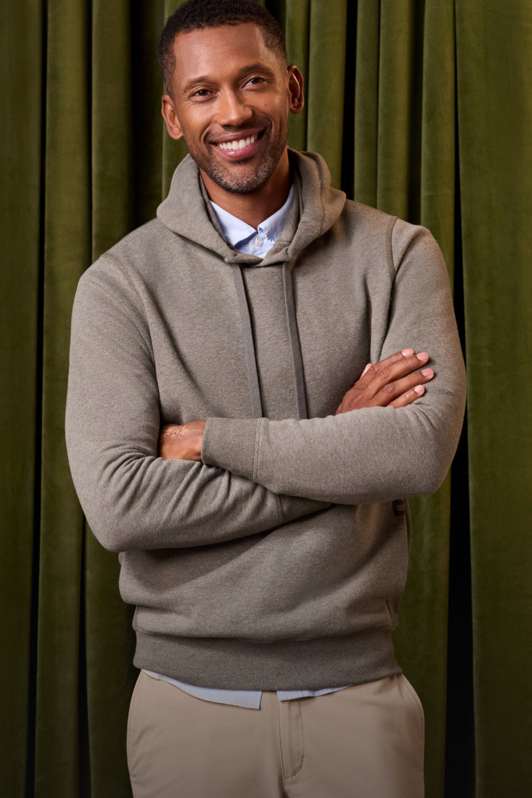 Man wearing ACE Pullover Hooded Sweatshirt in Sage Heather