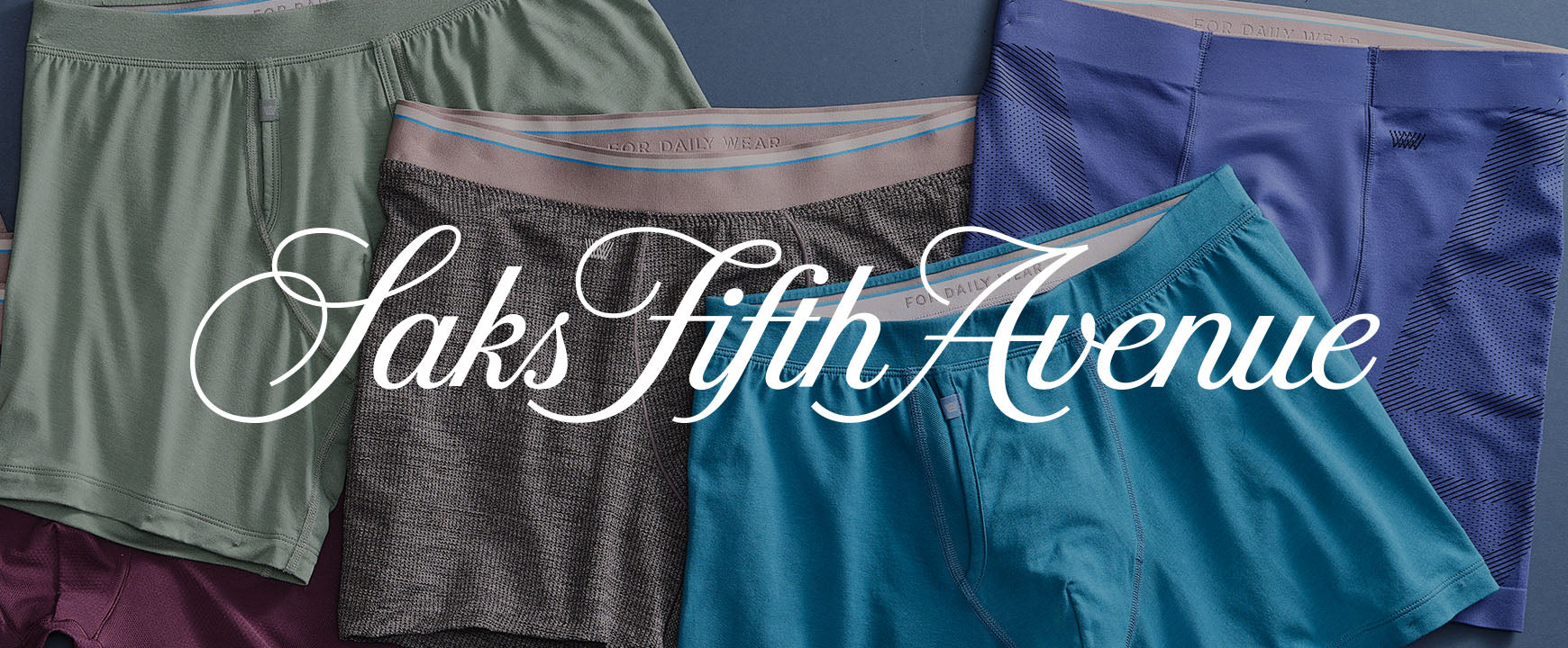 an array of boxer briefs laid out with a "Saks fifth Avenue" logo across the image