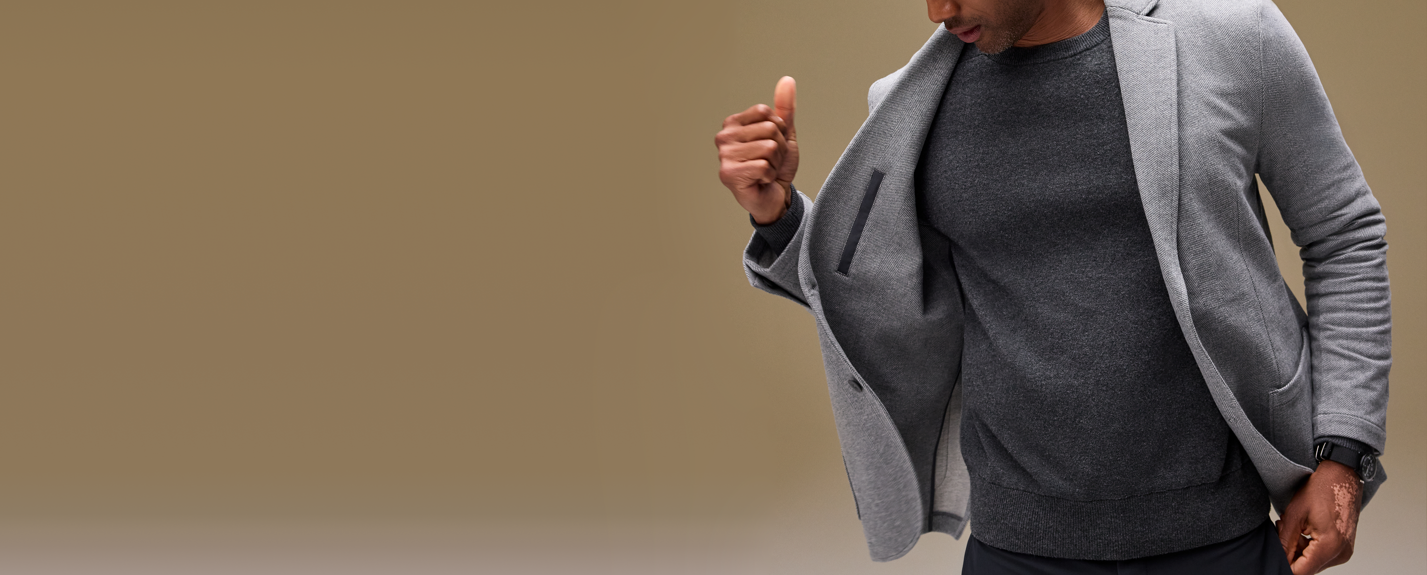 Guy holding open his ACE Blazer to show inside pocket