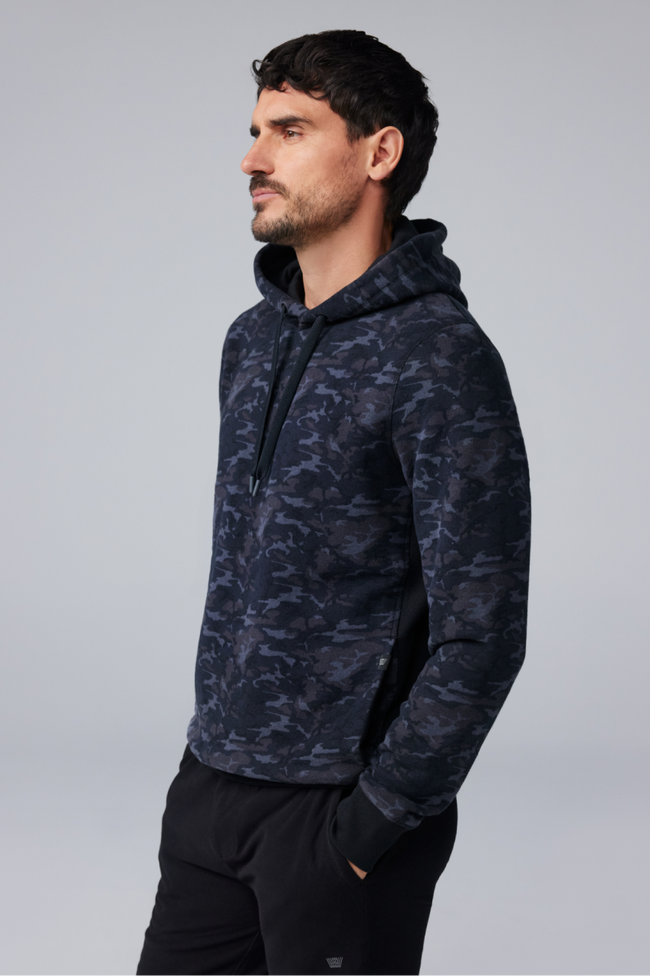 Man wears navy blue camo hoodie