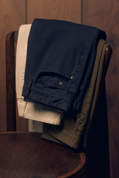 Three pairs of folded Mack Weldon pants