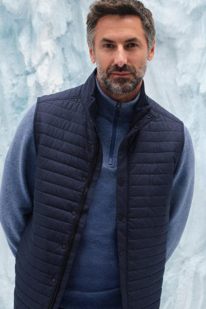 Front view of man wearing WARMKNIT AIR Puffer Vest