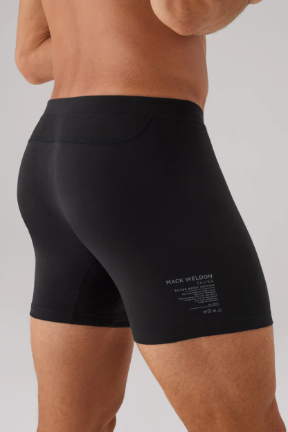 Side view of a man wearing SILVER Boxer brief in True Black