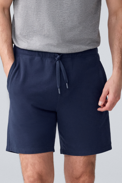 Man wearing Ace Sweatshort 9" in Total Eclipse