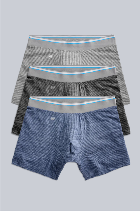 Three pairs of men's boxer briefs in light gray, dark gray, and blue, with light gray waistbands and blue stripes.