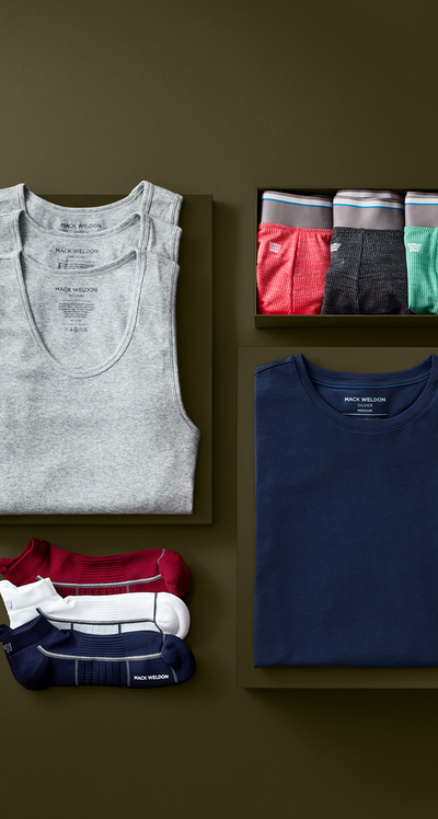 Collection of men's underwear and tank top on a brown background