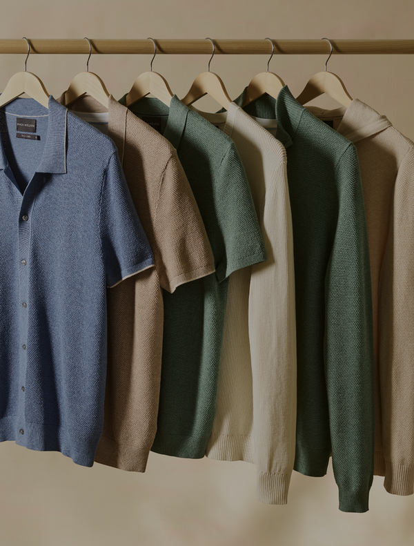 different tops hanging on a rack